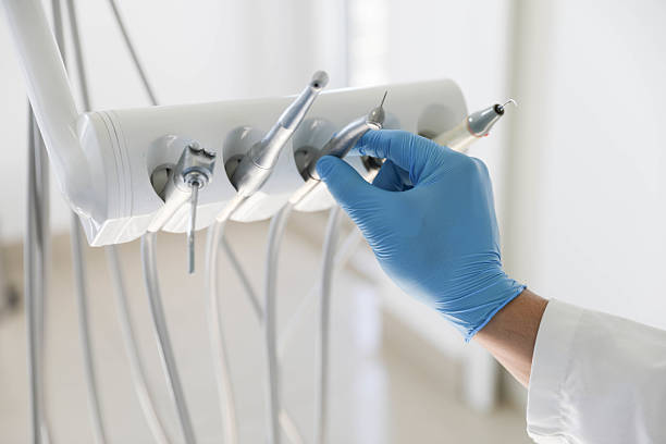 Professional Tooth Extraction technician working in Underwood-Petersville, AL